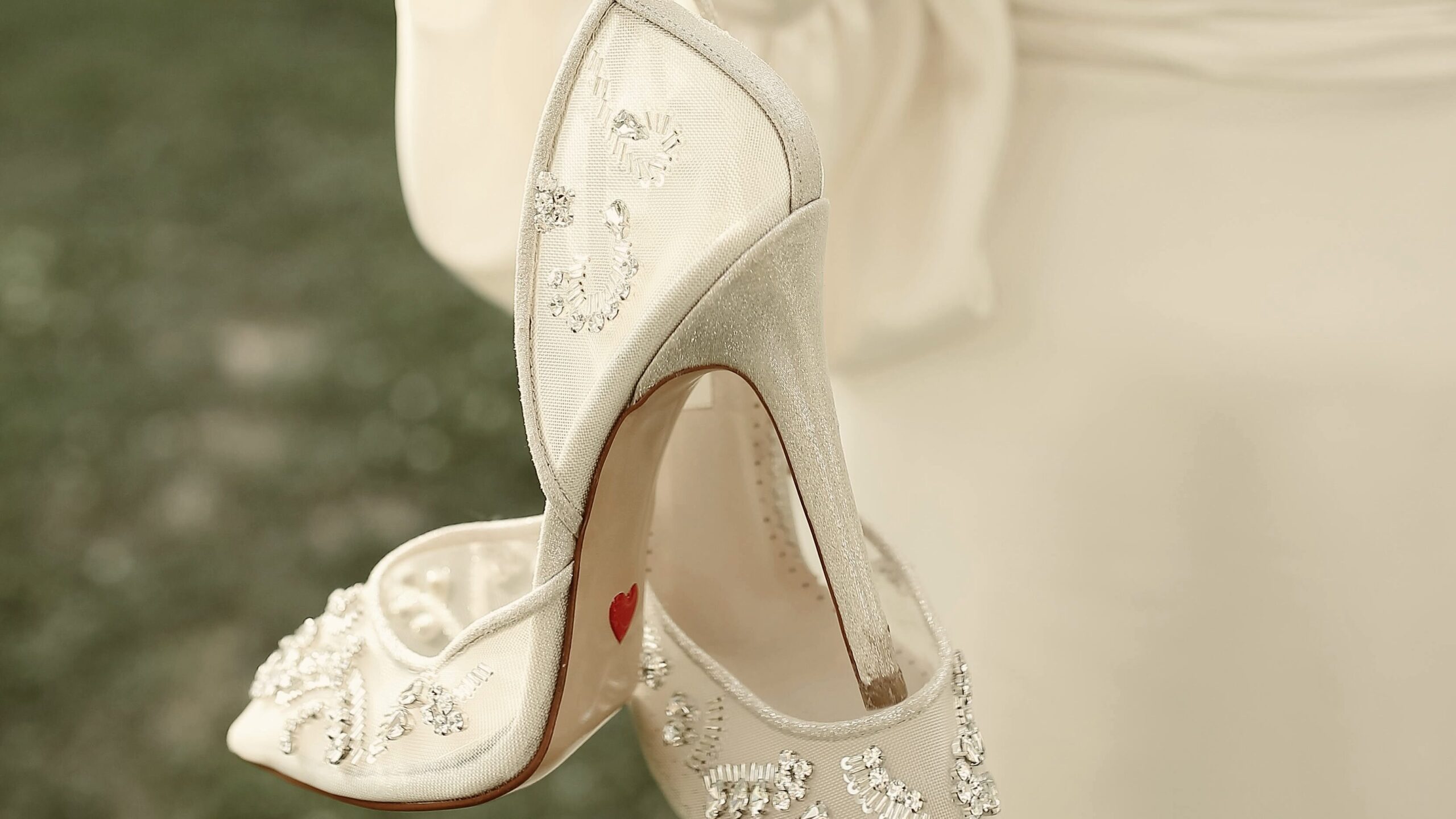 a picture of a bride holding her wedding heels